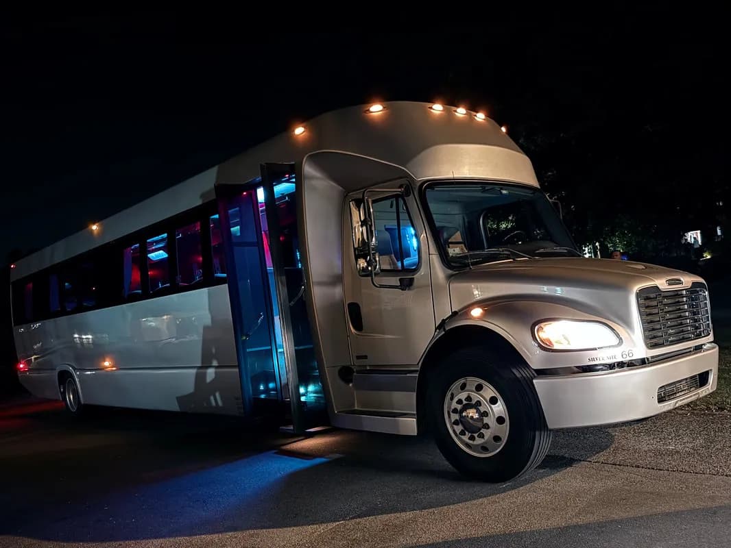 Silver Freightliner Party Bus exterior shot Silver Freightliner Party Bus exterior shot
