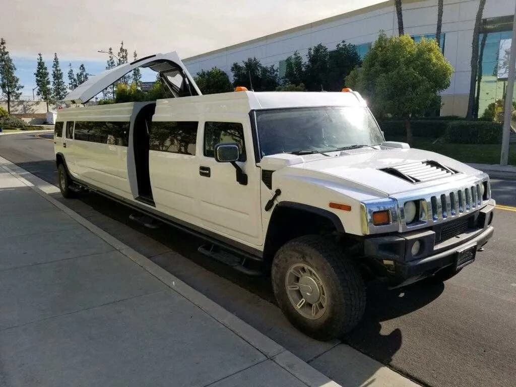 White Hummer Limo exterior with tinted windows and bridal (jet) door for limo rental in Botetourt County, VA White Hummer Limo exterior with tinted windows and bridal (jet) door for limo rental in Botetourt County, VA