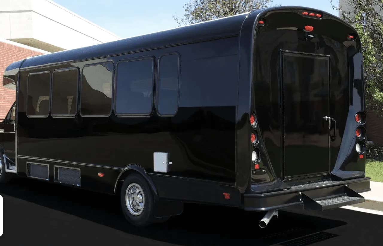 Black Limousine Coach exterior shot — tinted windows Black Limousine Coach exterior shot — tinted windows