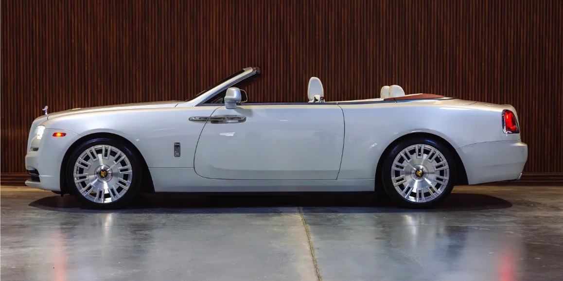 White Rolls-Royce Dawn exterior shot — convertible roof White Rolls-Royce Dawn exterior shot — convertible roof