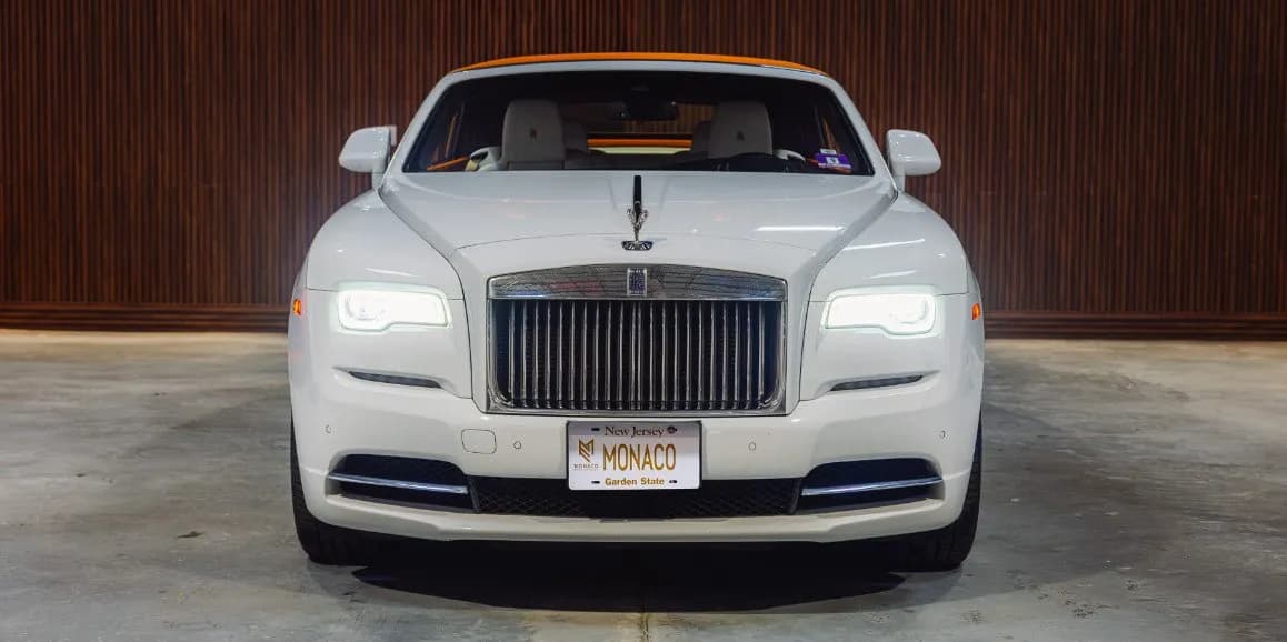 White Rolls-Royce Dawn (Hermes) exterior shot — convertible roof White Rolls-Royce Dawn (Hermes) exterior shot — convertible roof