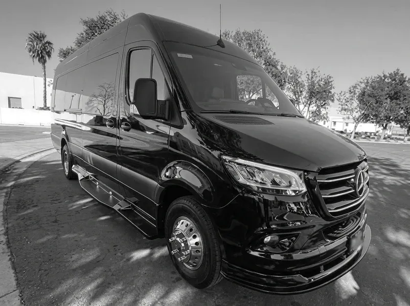 Black 2024 Mercedes-Benz 14 Passenger Party Bus offered for party bus rental