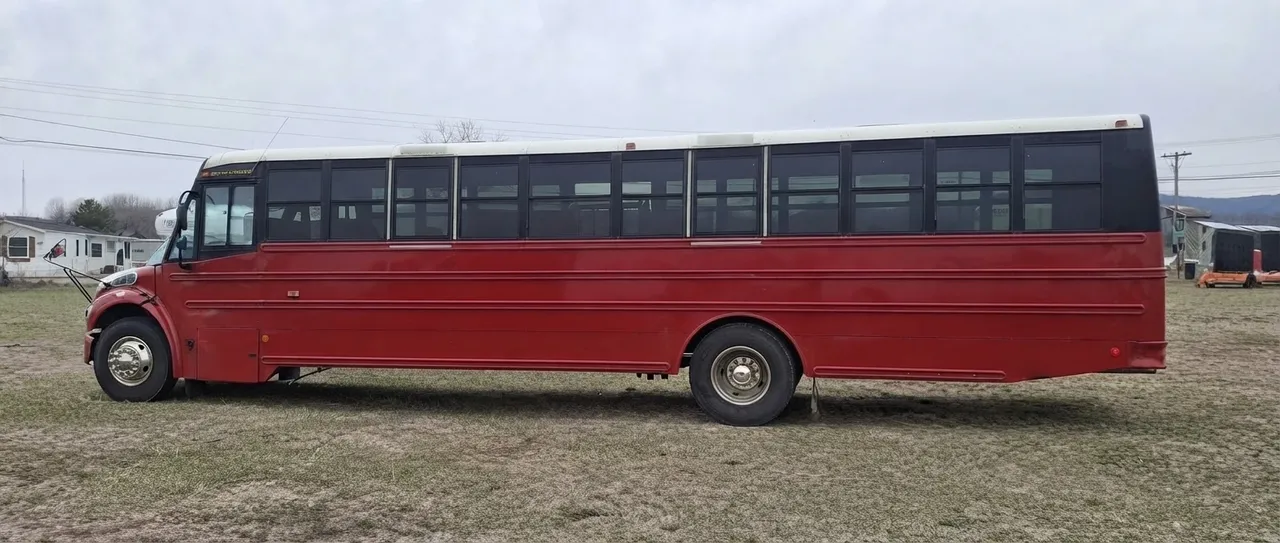 Big Red Party Bus offered for party bus rental