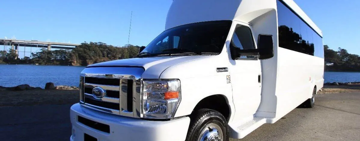 White Ford F-550 Party Bus exterior with tinted windows for party bus rental