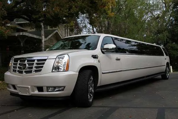 White Cadillac Escalade Limo with tinted windows for limo rental in Beale Afb, CA White Cadillac Escalade Limo with tinted windows for limo rental in Beale Afb, CA
