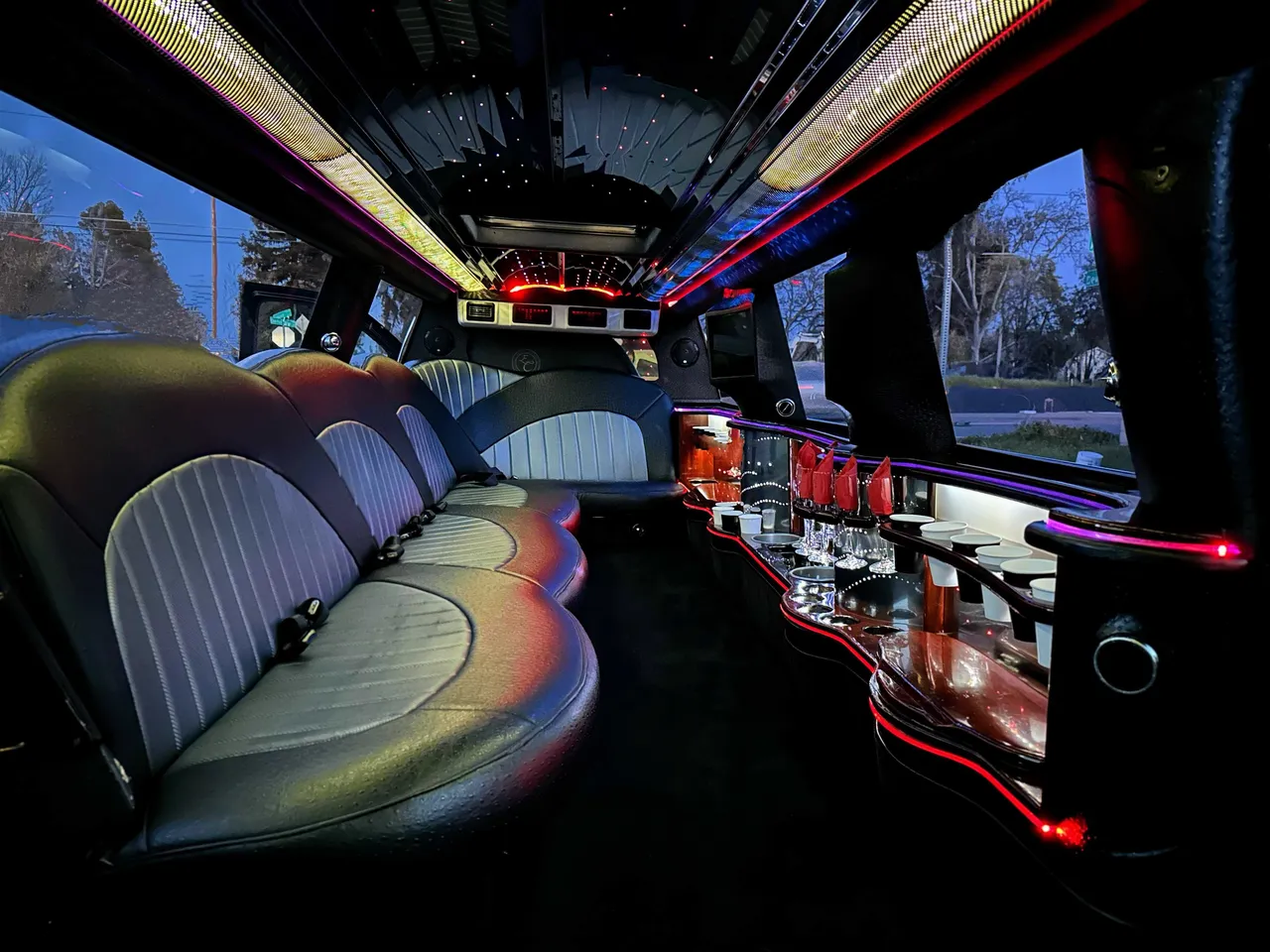 Cadillac Escalade Limo Cadillac Escalade Limo interior with LED accent lighting, LED ceiling lighting and bar area for limo rental