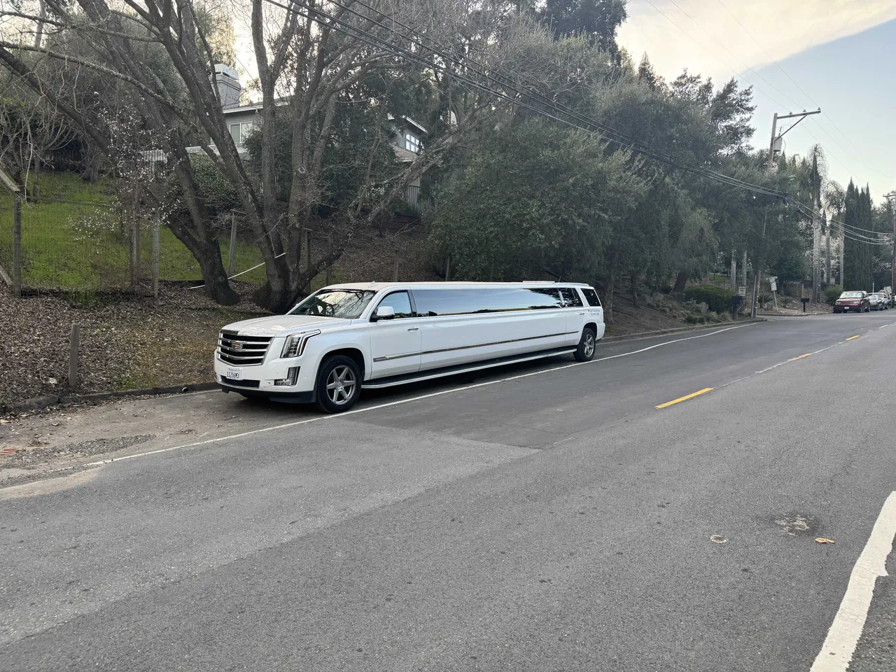 White Cadillac Escalade Limo with tinted windows for limo rental in Humboldt County, CA