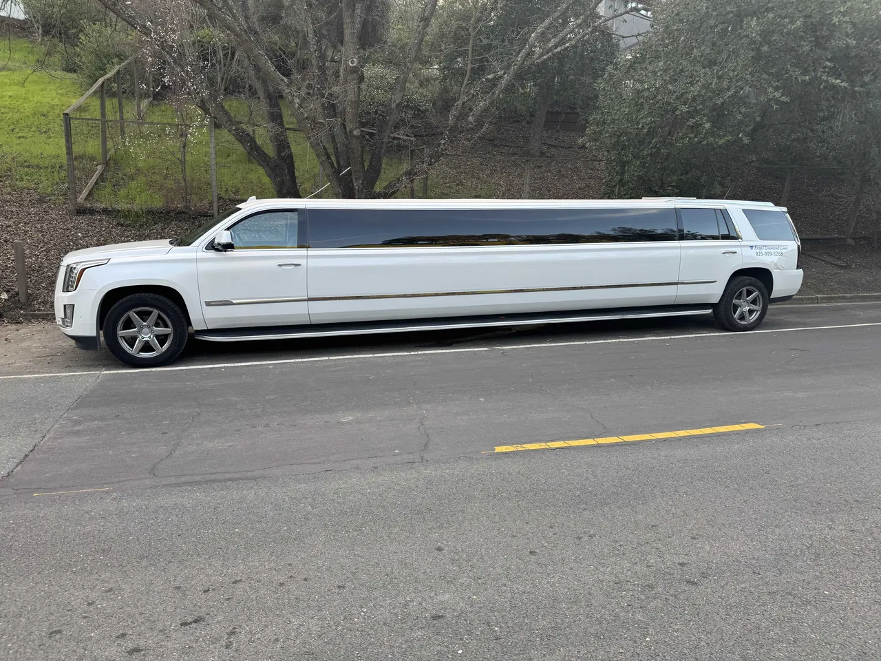 White Cadillac Escalade Limo exterior with tinted windows for limo rental in Humboldt County, CA