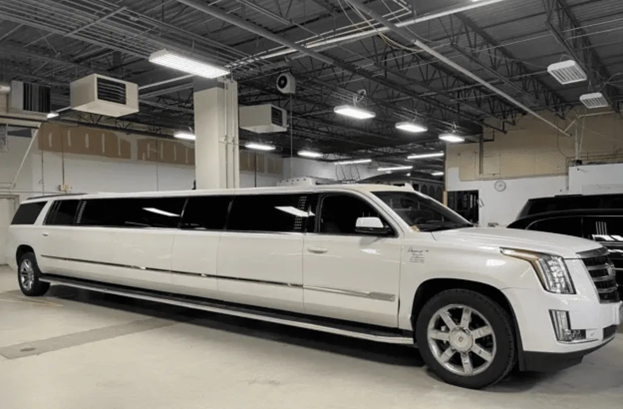 White Cadillac Escalade Limousine with tinted windows for limo rental in Fulton County, IL White Cadillac Escalade Limousine with tinted windows for limo rental in Fulton County, IL