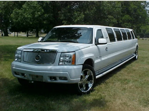 White Cadillac Escalade Limousine exterior shot — tinted windows and running boards