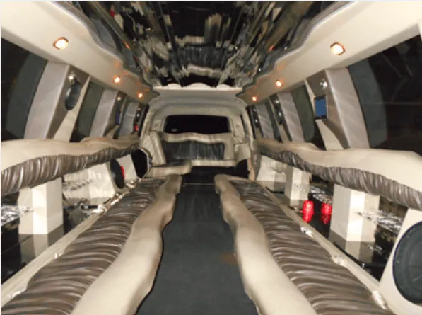 Cadillac Escalade Limousine interior shot — perimeter lounge seating and mirrored ceiling