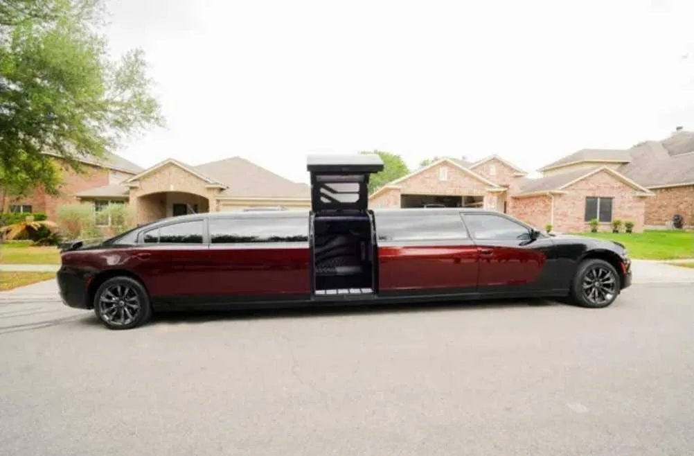 Charger Limo Black Charger Limo with tinted windows and bridal (jet) door for limo rental