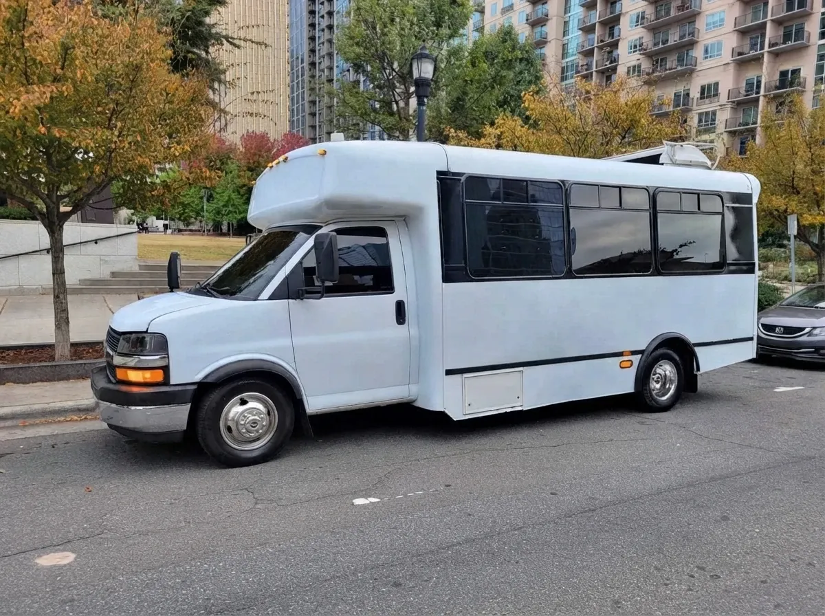 White Chevrolet Party Bus offered for party bus rental