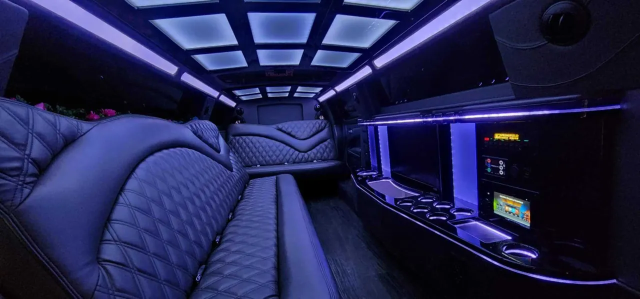 10 Passenger Chrysler 300 Limousine interior with perimeter lounge seating, LED accent lighting and LED ceiling lighting for limo rental