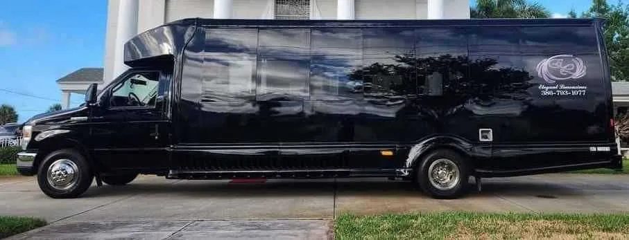 Black 2019 Luxury Party Bus (Dark Shadow) exterior shot — tinted windows
