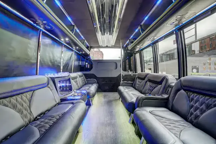 Grech Party Bus interior with perimeter lounge seating, sofa-style seating and LED accent lighting, photo 2 for party bus rental in Illinois