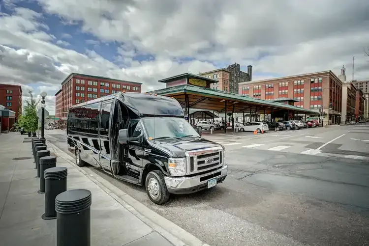 Black Grech Party Bus exterior with tinted windows for party bus rental in Illinois
