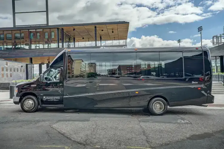 Black Grech Party Bus exterior with tinted windows, photo 4 for party bus rental in Illinois