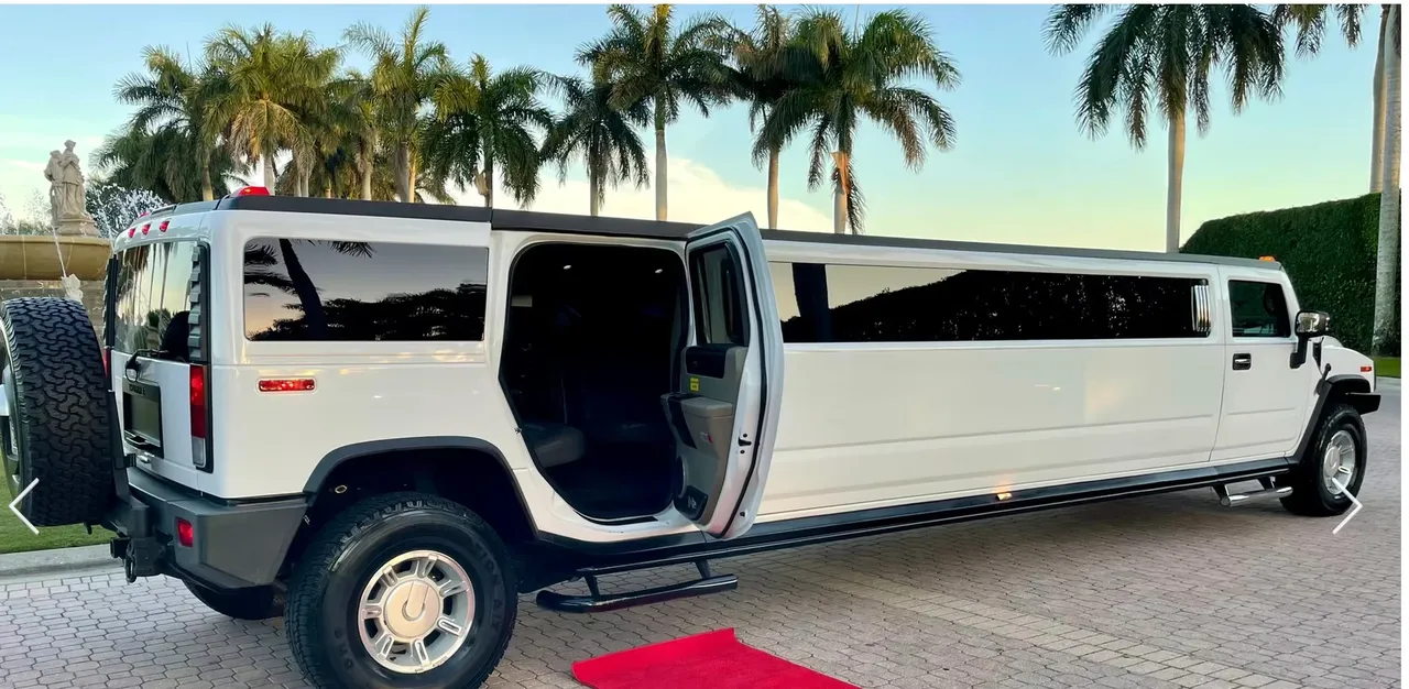 White 15 Passenger Hummer H2 with tinted windows and running boards for limo rental