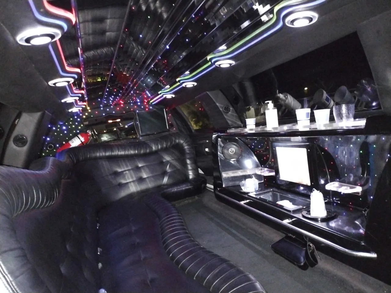 Lincoln limousine interior with LED ceiling lighting, starlight or fiber-optic ceiling and bar area for limo rental in Riverside County, CA Lincoln limousine interior with LED ceiling lighting, starlight or fiber-optic ceiling and bar area for limo rental in Riverside County, CA
