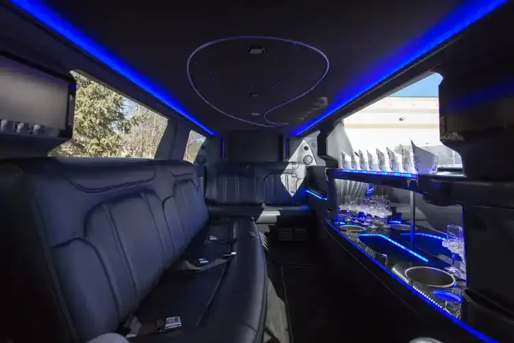 Lincoln MKT Limousine interior with LED accent lighting, starlight or fiber-optic ceiling and bar area for limo rental