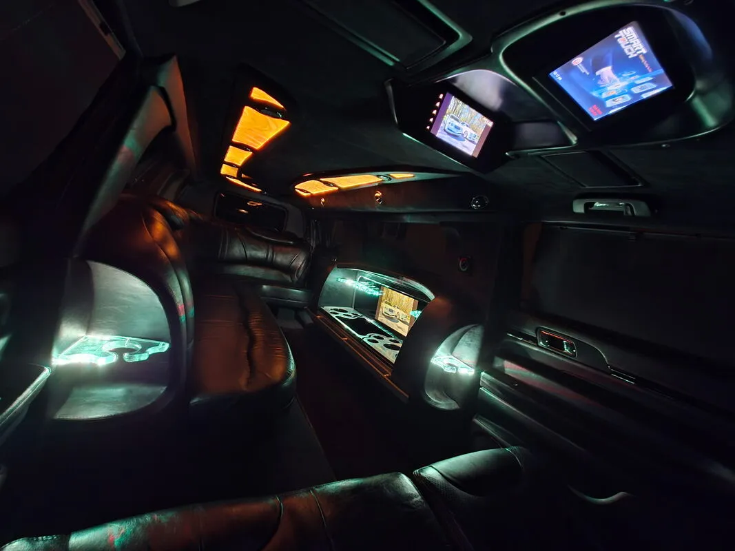Lincoln MKT Limousine interior with LED accent lighting and TV screens, photo 2 for limo rental