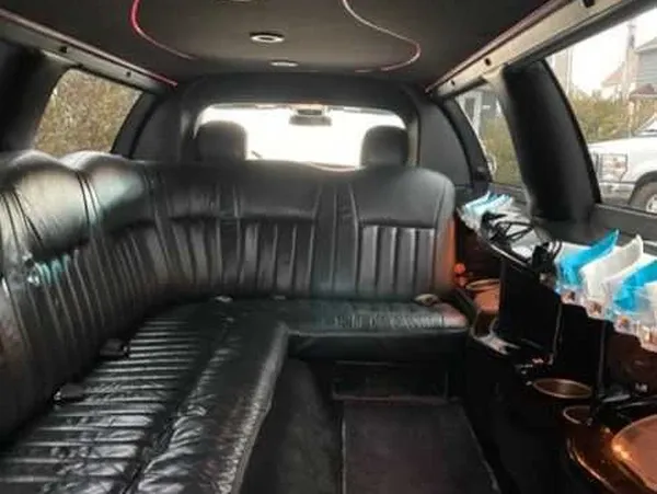 White Lincoln Town Car offered for limo rental