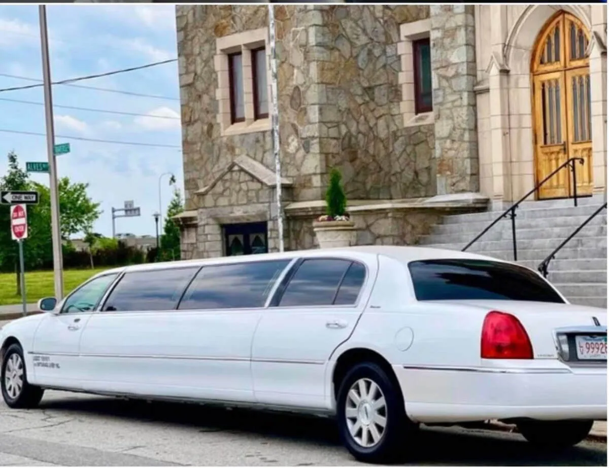 White Lincoln Town CAR Limousine with tinted windows for limo rental in Oswego County, NY