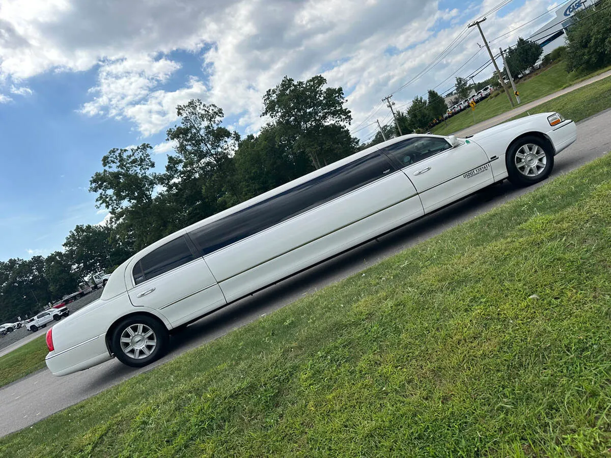 White Lincoln Town CAR Limousine with tinted windows for limo rental in Bennington, VT