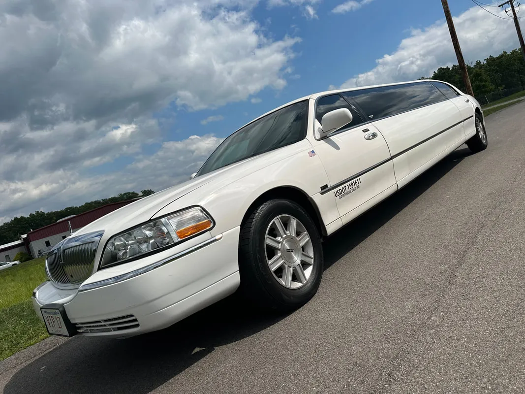 White Lincoln Town CAR Limousine exterior with tinted windows for limo rental in Bennington, VT