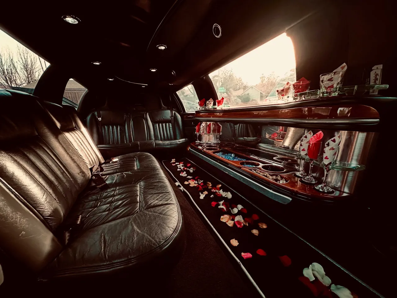 Lincoln Towncar Limo interior with perimeter lounge seating, cup holders and bar area for limo rental in Beale Afb, CA Lincoln Towncar Limo interior with perimeter lounge seating, cup holders and bar area for limo rental in Beale Afb, CA