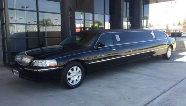 Black Lincoln Town Car Limousine — tinted windows