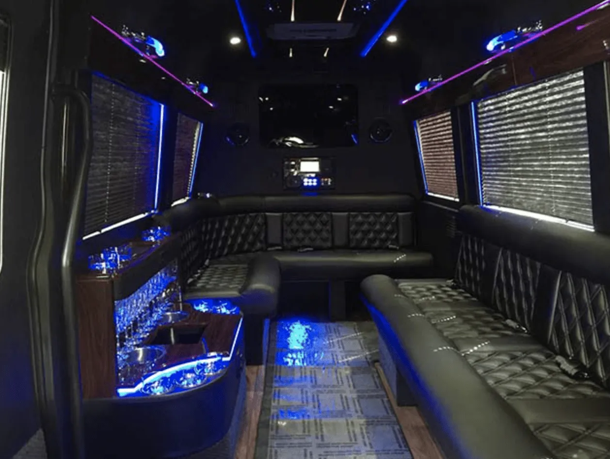 Mercedes-Benz Limousine Sprinter interior with perimeter lounge seating, window shades and LED accent lighting for party bus rental