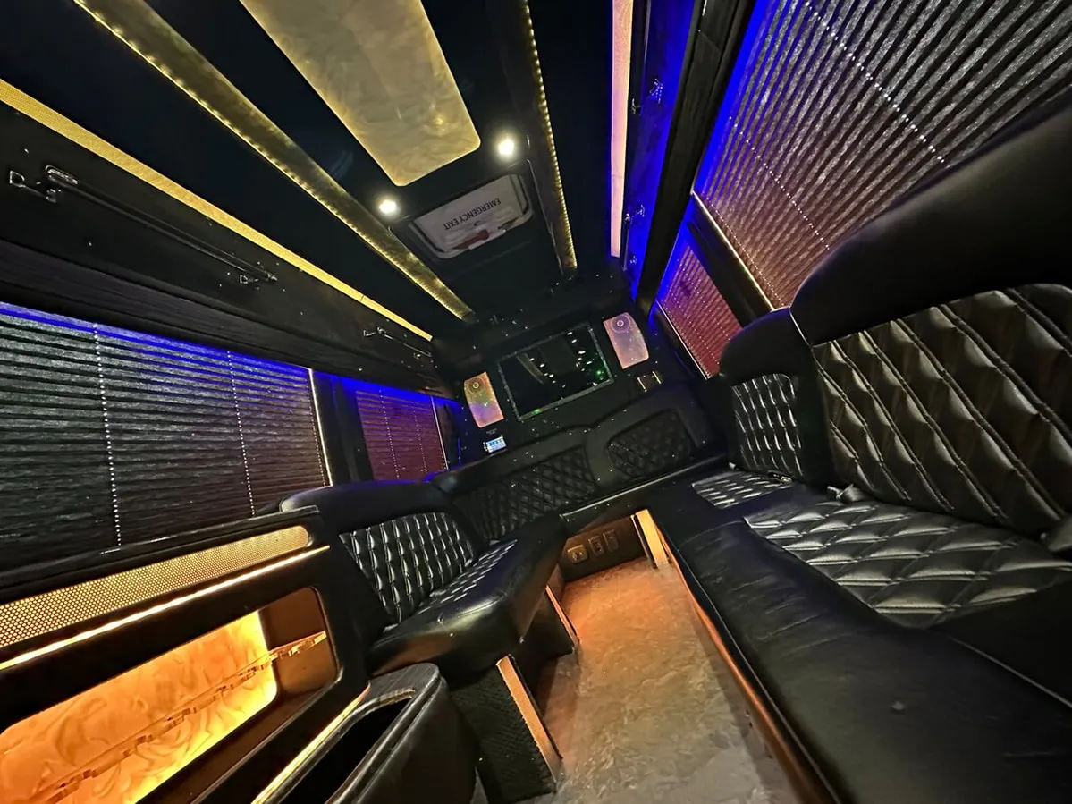 Mercedes Sprinter XL interior with perimeter lounge seating, window shades and LED accent lighting, photo 2 for party bus rental