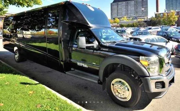 Black Mini Coach Limo Bus exterior for party bus rental Black Mini Coach Limo Bus exterior for party bus rental