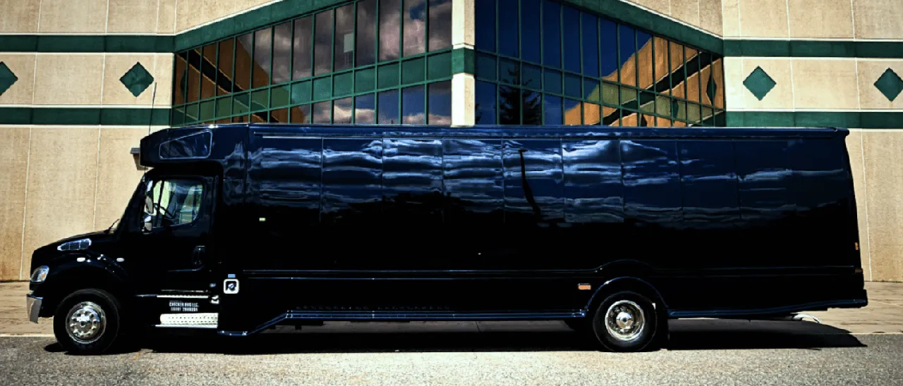Black 28 Passenger Party Bus exterior with tinted windows for party bus rental in Fulton County, IL Black 28 Passenger Party Bus exterior with tinted windows for party bus rental in Fulton County, IL