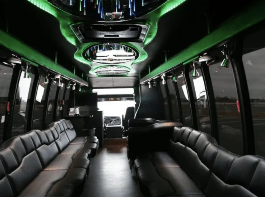 28 Passenger Party Bus interior with perimeter lounge seating, LED accent lighting and LED ceiling lighting for party bus rental in Fulton County, IL 28 Passenger Party Bus interior with perimeter lounge seating, LED accent lighting and LED ceiling lighting for party bus rental in Fulton County, IL