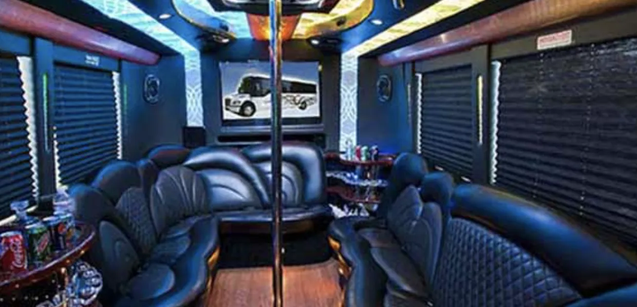 24 Passenger Party Bus interior with perimeter lounge seating, sofa-style seating and window shades for party bus rental in Orange County, CA 24 Passenger Party Bus interior with perimeter lounge seating, sofa-style seating and window shades for party bus rental in Orange County, CA