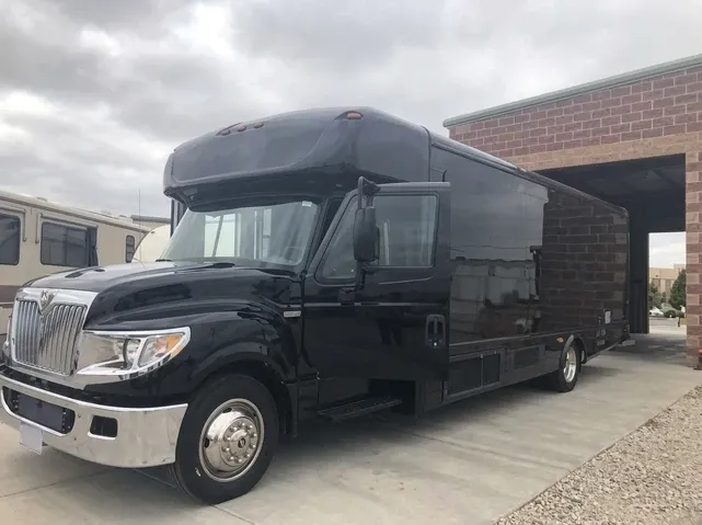 Black 28 Passenger Party Bus offered for party bus rental