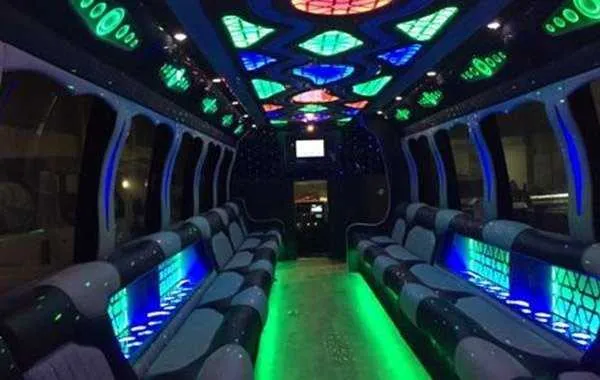 Party Bus Black interior shot — perimeter lounge seating, LED accent lighting and LED ceiling lighting