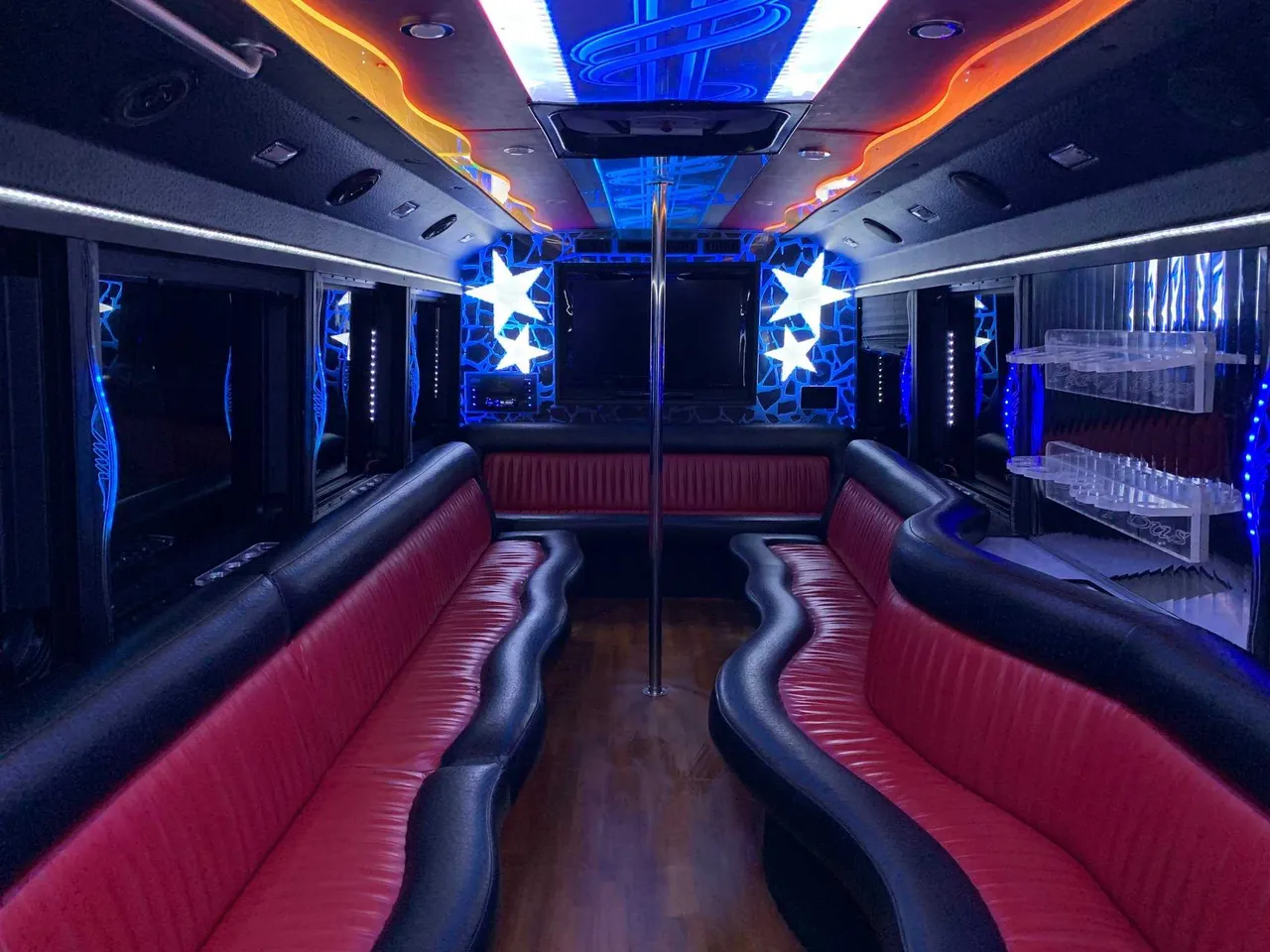 Party Bus - Frank SInatra interior with perimeter lounge seating, LED accent lighting and LED ceiling lighting for party bus rental