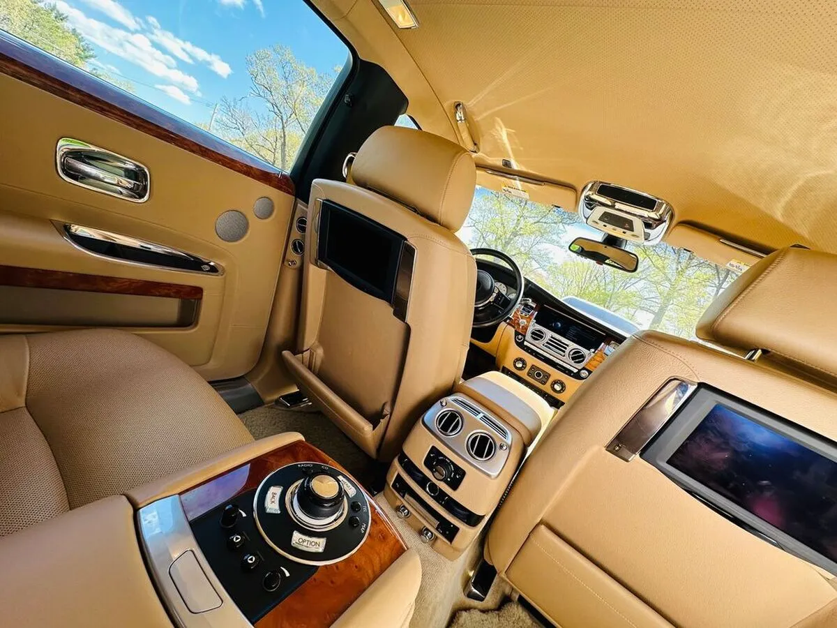 Rolls-Royce Ghost Sedan interior shot — rear-seat entertainment screens