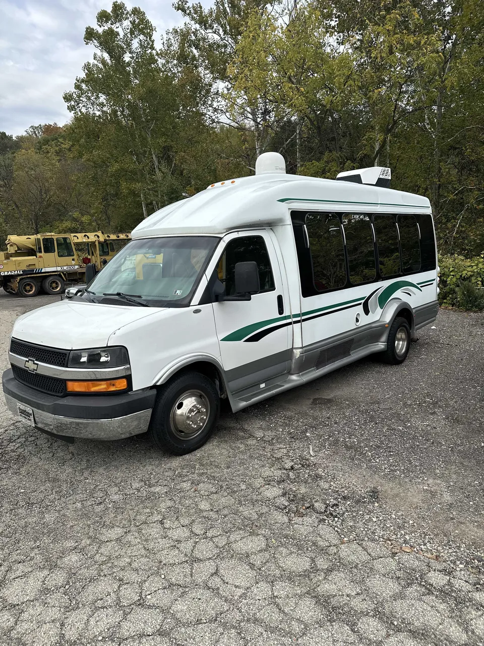 White Small party bus exterior with tinted windows for party bus rental White Small party bus exterior with tinted windows for party bus rental