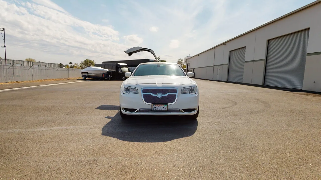 White Chrysler 300 Stretch Limousine — 10–12 Advertised for limo rental